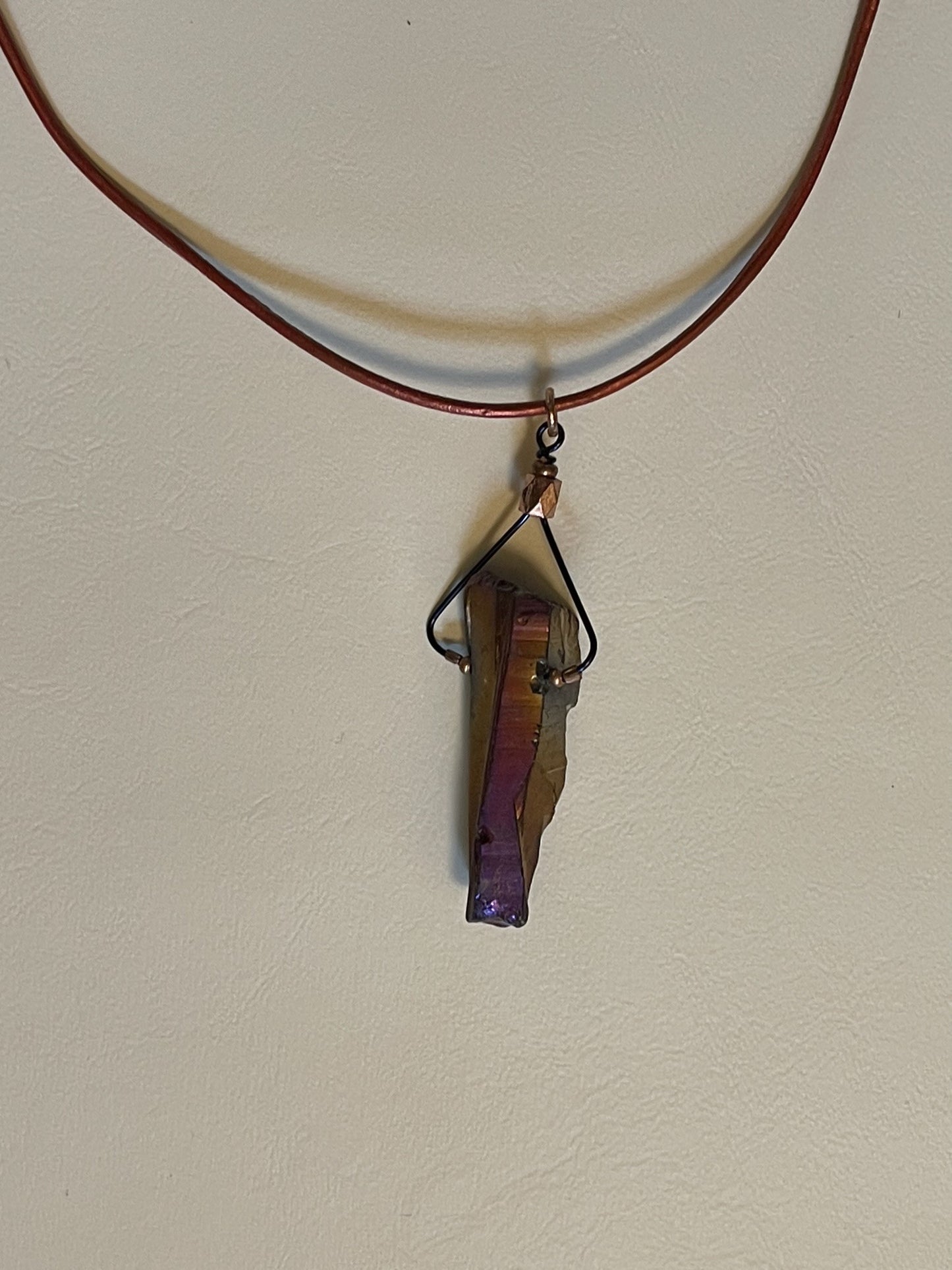Long Quartz Crystal on Long Copper Colored Leather Cord