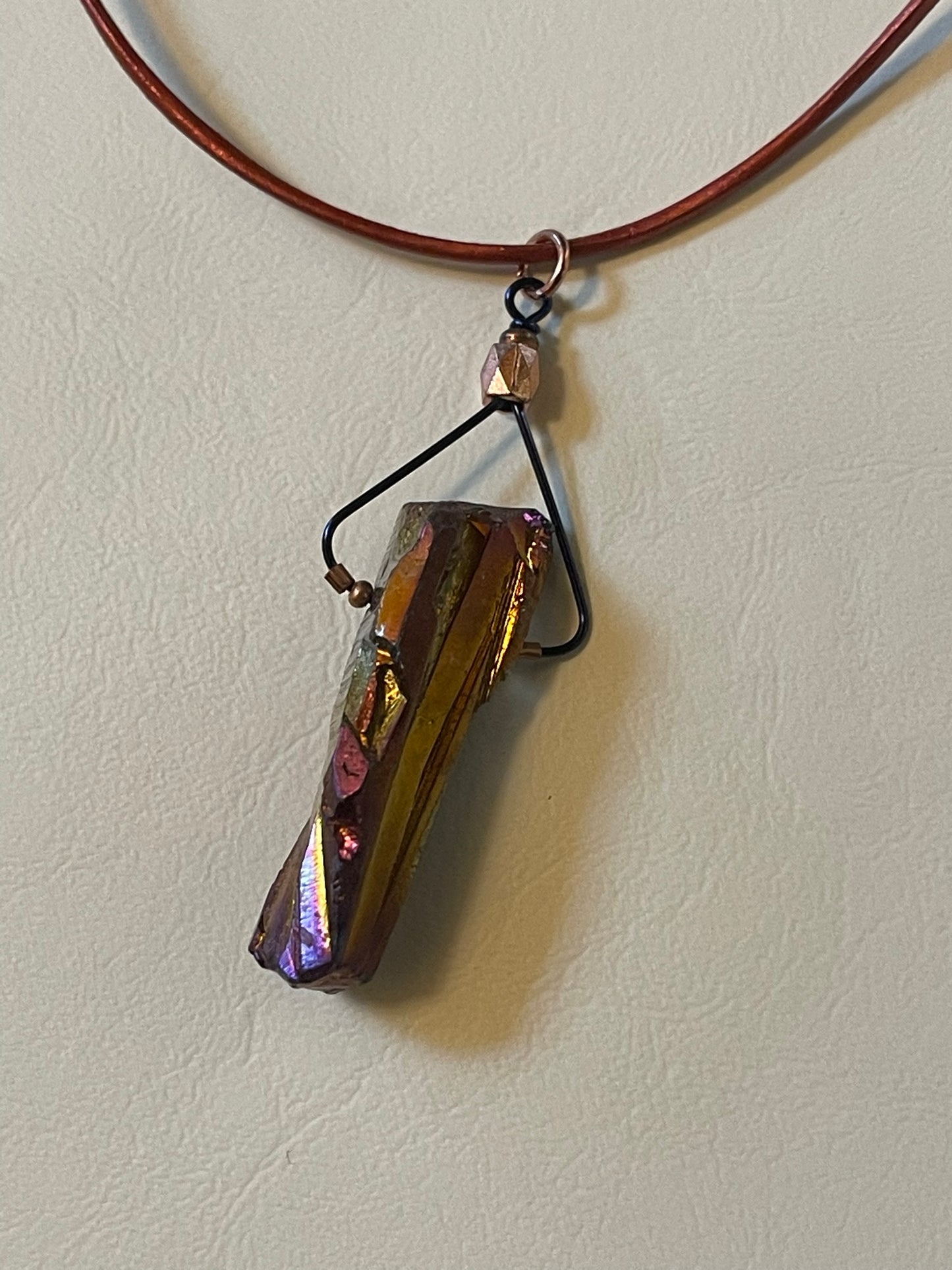 Long Quartz Crystal on Long Copper Colored Leather Cord