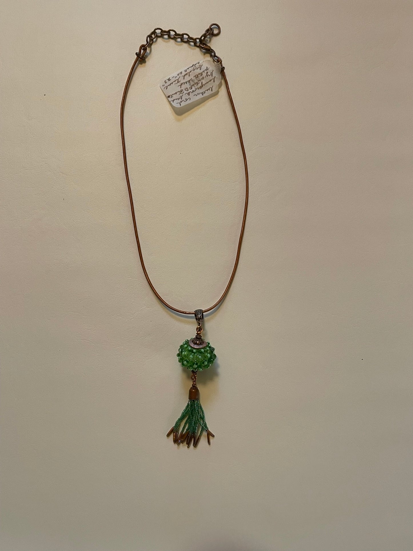 Artisanal Bead with Handmade Tassel of Seed Beads with Copper-Colored Leather Cord