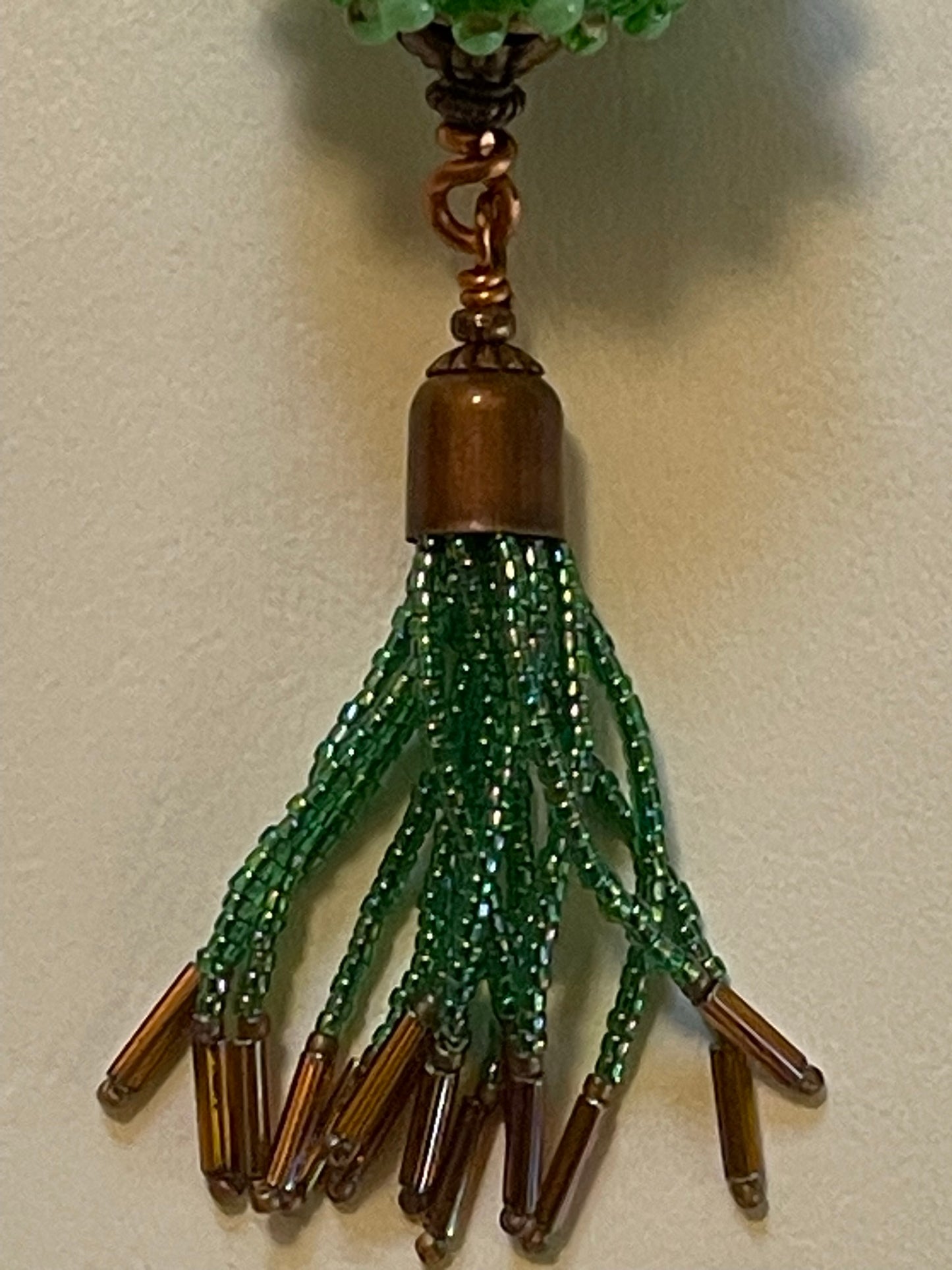 Artisanal Bead with Handmade Tassel of Seed Beads with Copper-Colored Leather Cord